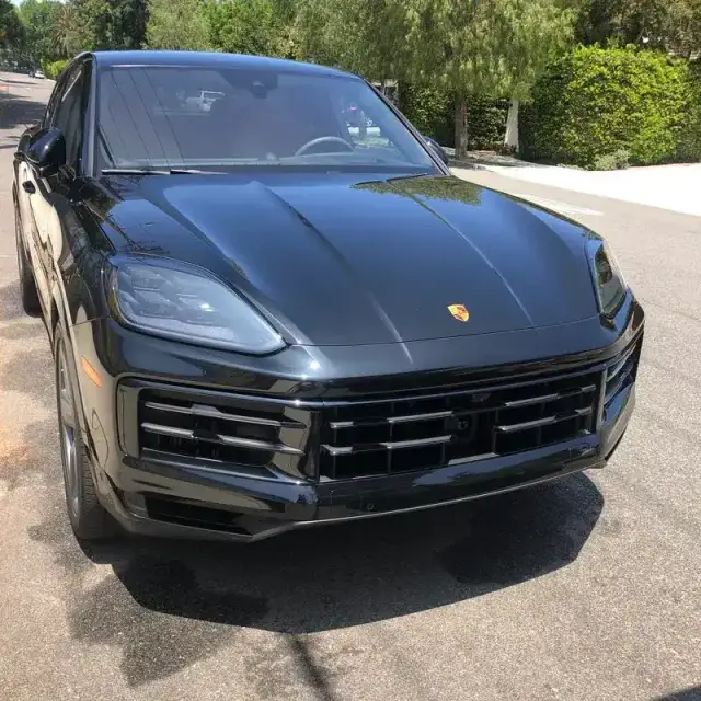 A black Porsche Cayenne Coupe detailed on a private street in Hidden Hills, CA