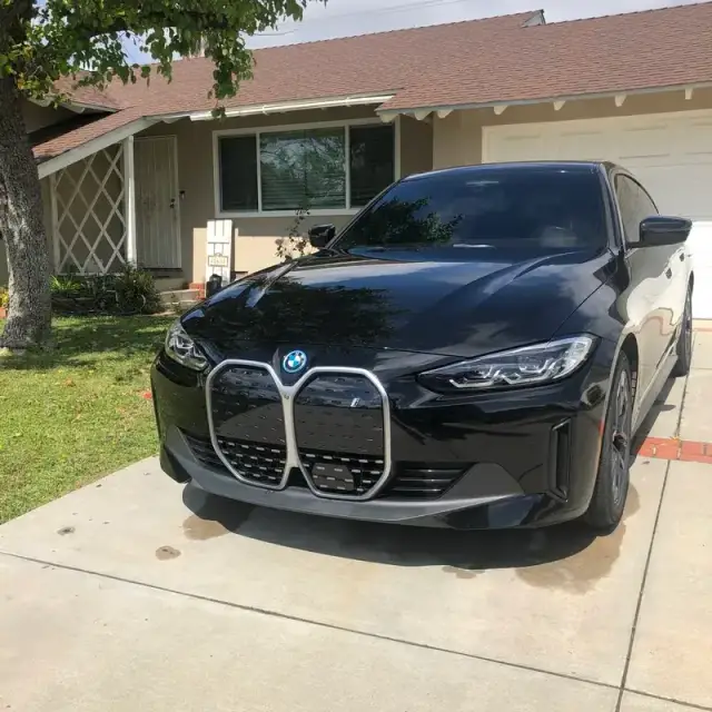 A BMW i4 detailed on a driveway in West Hills, CA